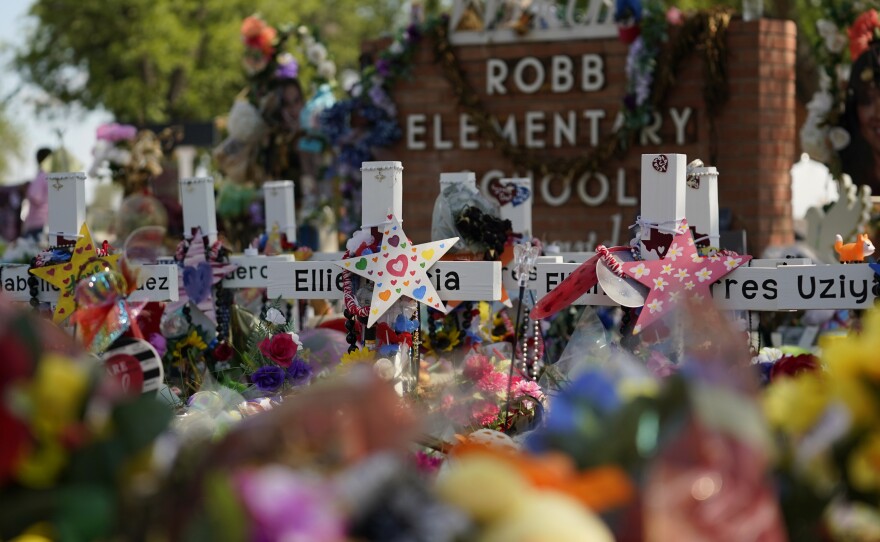 Crosses, flowers and other memorabilia form a make-shift memorial for the victims of the shootings at Robb Elementary School in Uvalde, Texas.