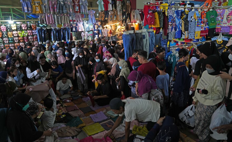 Shopers at Tanah Abang market in Jakarta on Thursday. Muslims around the world are preparing for the Eid al-Fitr holiday, which is usually marked with feasts and celebration.