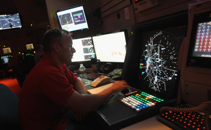<p>An air traffic controller monitors flights in July at the Denver International Airport. The Federal Aviation Administration is planning to modernize its traffic control system, but has faced a number of obstacles.</p>