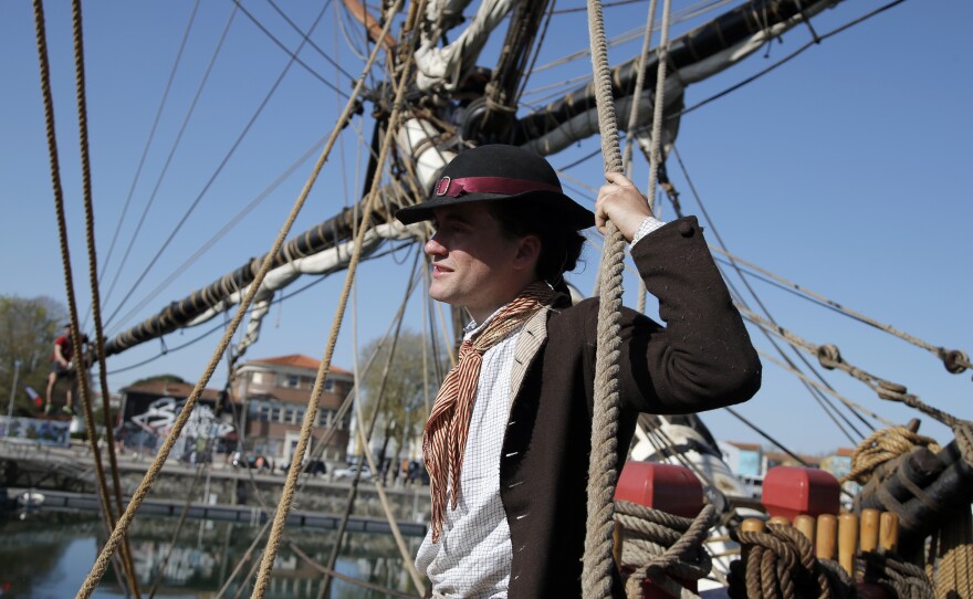 Adam Hodges-LeClaire is outfitted as an 18th-century sailor, down to his woolen socks and leather buckle shoes.