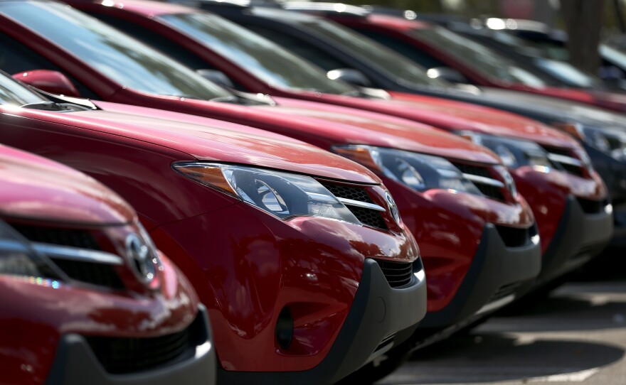 Auto dealers are extending loans to a growing number of people with weak credit.