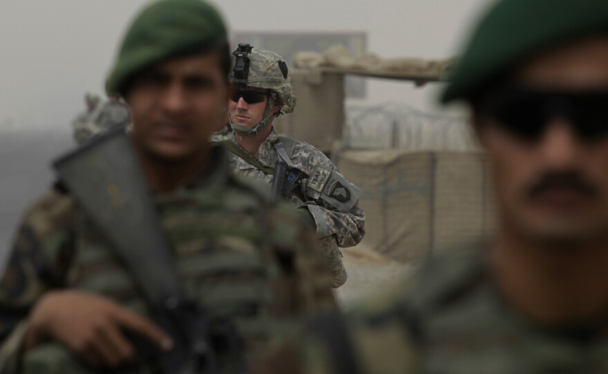 U.S. Army 1s Lt. Blair Downey patrols with Afghan army soldiers in Kandahar province, Afghanistan, last month.