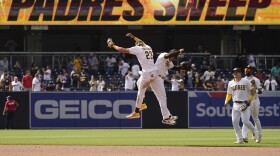 San Diego Padres shortstop Fernando Tatis Jr., left, celebrates with teammate center fielder Trent Grisham after the Padres defeated the Colorado Rockies 3-0 in a baseball game Wednesday, May 19, 2021, in San Diego.