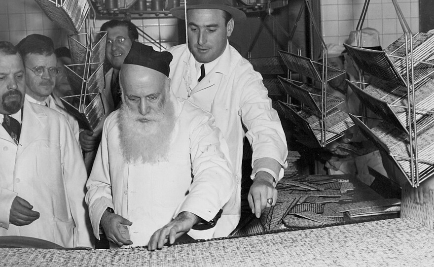 A rabbi (center) supervises the production of Passover matzos at the Streit's factory in New York's Lower East Side, circa 1960s. At right is Aron Gross, grandson-in-law of company founder Aron Streit. This Passover will be Streit's last one at the landmark location.
