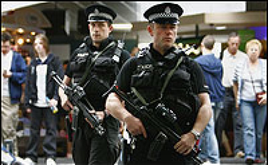 Armed police patrol Glasgow Airport as the U.K. terror alert remains at a critical level.