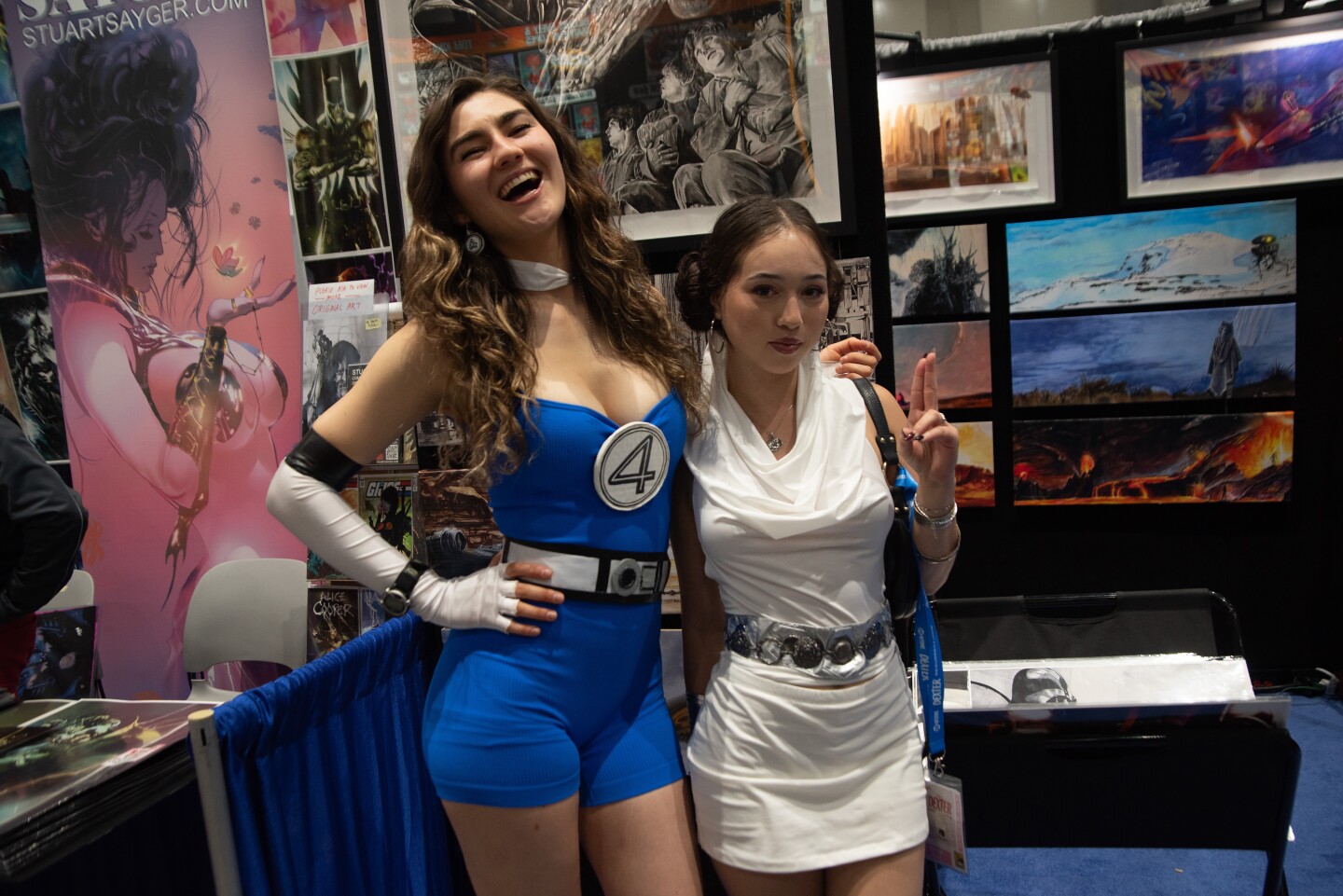 Cambrya Melendez cosplays as a member of the Fantastic Four. Maddie Suss cosplays as Princess Leah on July 25, 2025.