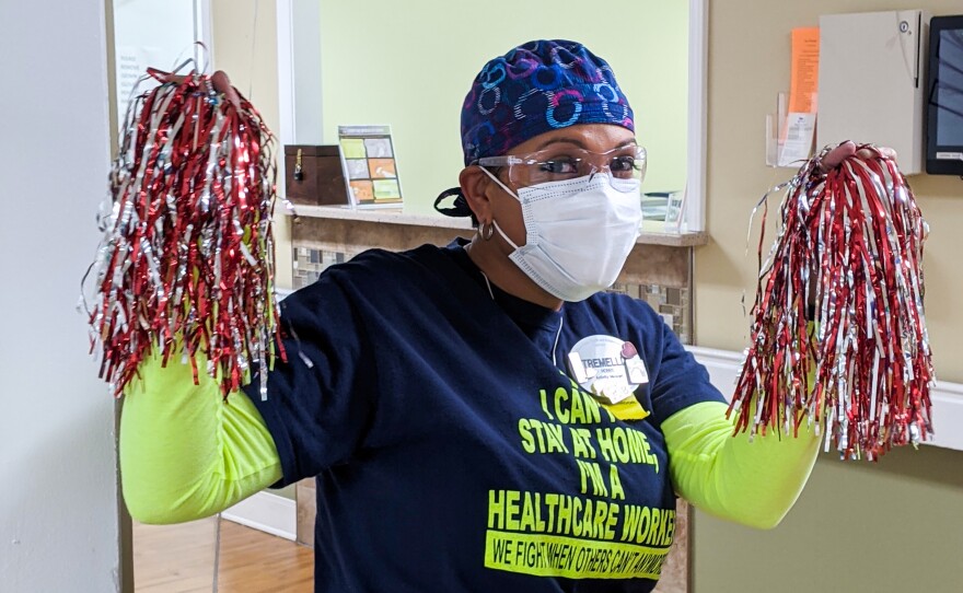 Tremellia Hobbs, activities director at the Brian Center/Cabarrus nursing home, cheers on her co-workers as they receive COVID-19 vaccines on Jan. 14, 2021.