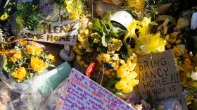 Yellow flowers and handwritten notes calling for the return of Nancy Guthrie sit outside the house of the 84-year-old mother of Today show co-host Savannah Guthrie, in Tucson, Ariz. Savannah Guthrie is speaking about her mother in an emotional two-part interview.