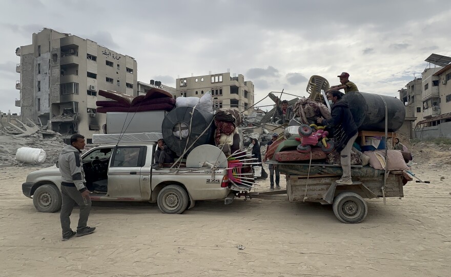 Palestinians displaced from Khan Younis returned after Israel's withdrawal to salvage belongings from their homes.