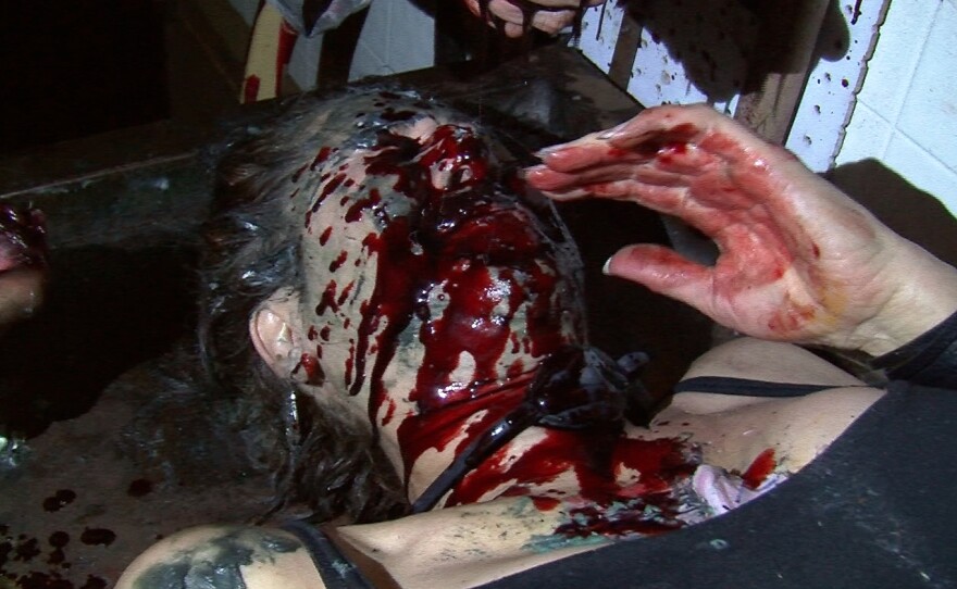 Beth Accomando's face is covered in blood during her four hour tour of McKamey Manor, Oct. 3, 2014.