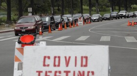 Motorists line up at a coronavirus testing site at Dodger Stadium Monday, June 29, 2020, in Los Angeles. 