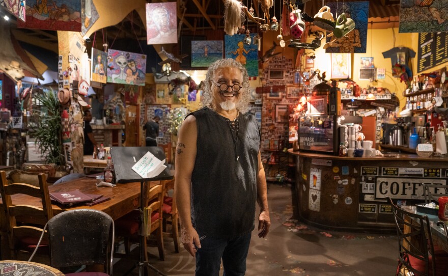 Farzad Azad, the owner of Java Jazz, often plays flamenco guitar during the cafe's music sessions.