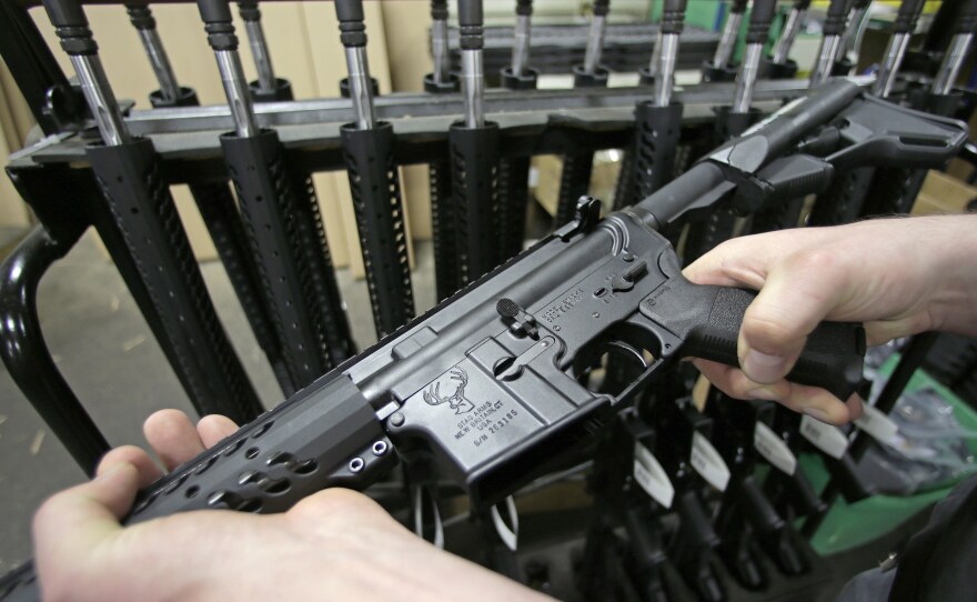 New York state's 2013 gun law includes a ban on the sale of so-called military-style assault weapons like this AR-15 rifle.