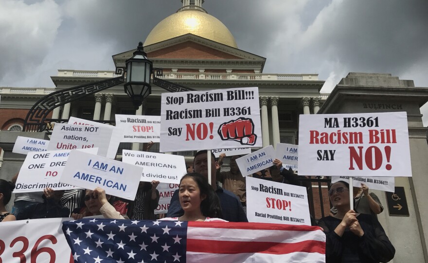 Protesters gather outside the Massachusetts State House in Boston for a July 28 demonstration against a bill that would require state agencies to collected detailed data on Asian-Americans and Pacific Islanders.