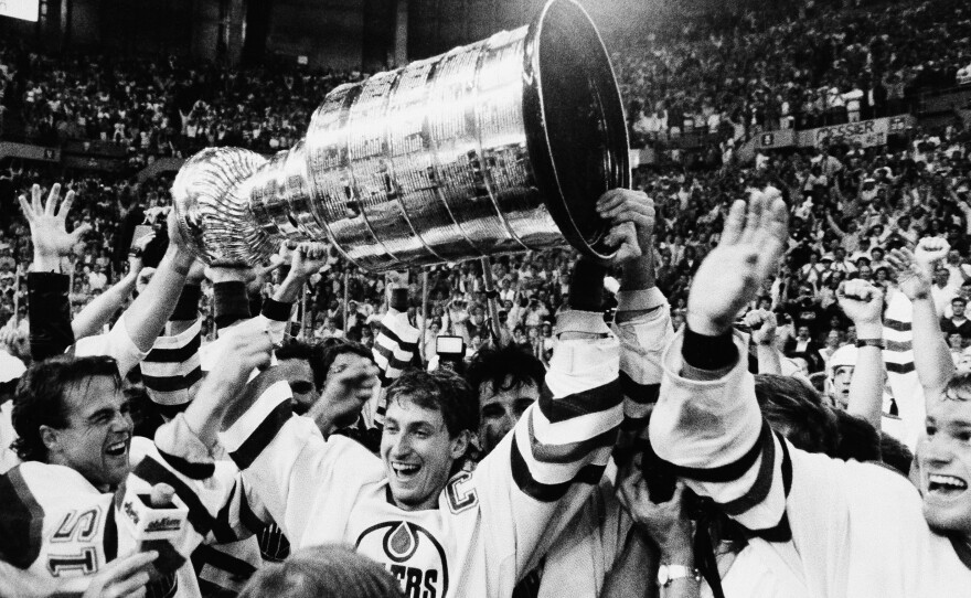 Wayne Gretzky is flanked by his Edmonton Oilers teammates after winning the Stanley Cup over the Philadelphia Flyers in May 1987.