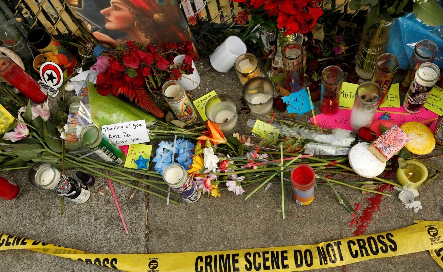 Candles, flowers and notes honor people who lost their lives in the Ghost Ship fire in Oakland, Calif., in December 2016.