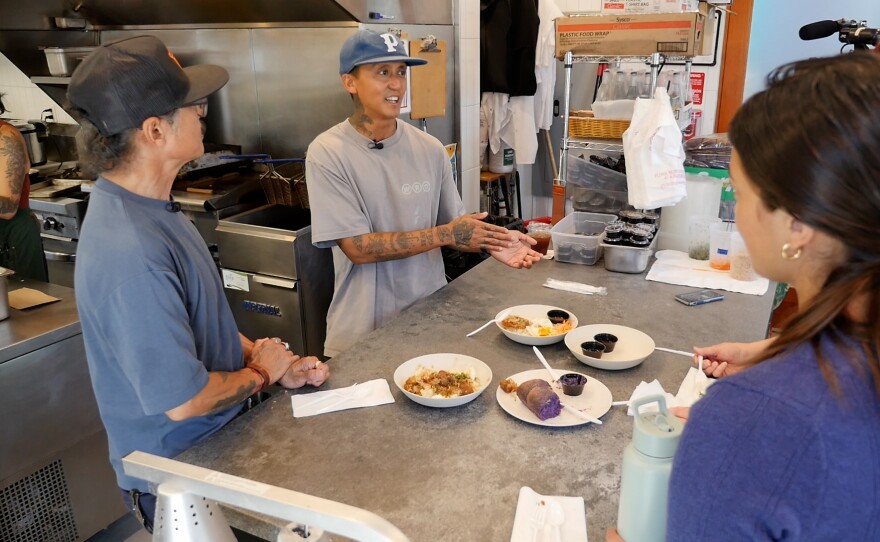 Chef Phillip Esteban talks to people in the kitchen of his Normal Heights restaurant White Rice Bodega on Aug. 27, 2024, San Diego, Calif. 