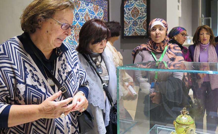 Shahinda Karim (left), a professor of Islamic Art at the American University in Cairo, leads a tour through the newly restored galleries.