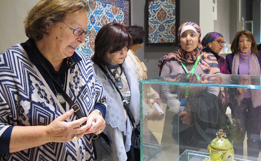 Shahinda Karim (left), a professor of Islamic Art at the American University in Cairo, leads a tour through the newly restored galleries.