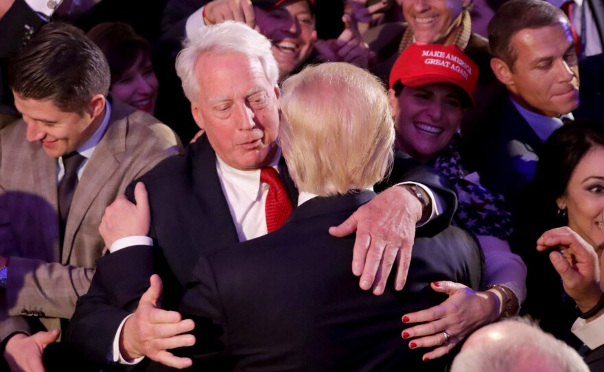 Republican president-elect Donald Trump hugs his brother Robert Trump after delivering his acceptance speech at the New York Hilton Midtown in the early morning hours of Nov. 9, 2016, in New York City.