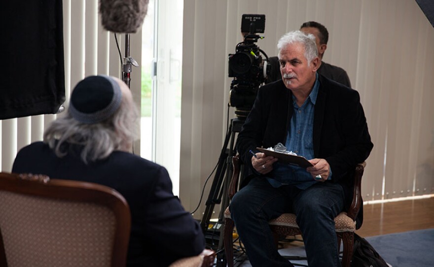 A behind-the-scenes photo of Director Isaac Artenstein interviewing Rabbi Wayne Dosick in "To The Ends Of The Earth: A Portrait Of Jewish San Diego."