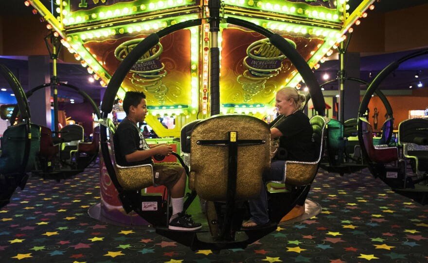 Tony, 13, spends an afternoon at an arcade with Ashley Wood, his occupational therapist in the Kickstart program in San Diego.