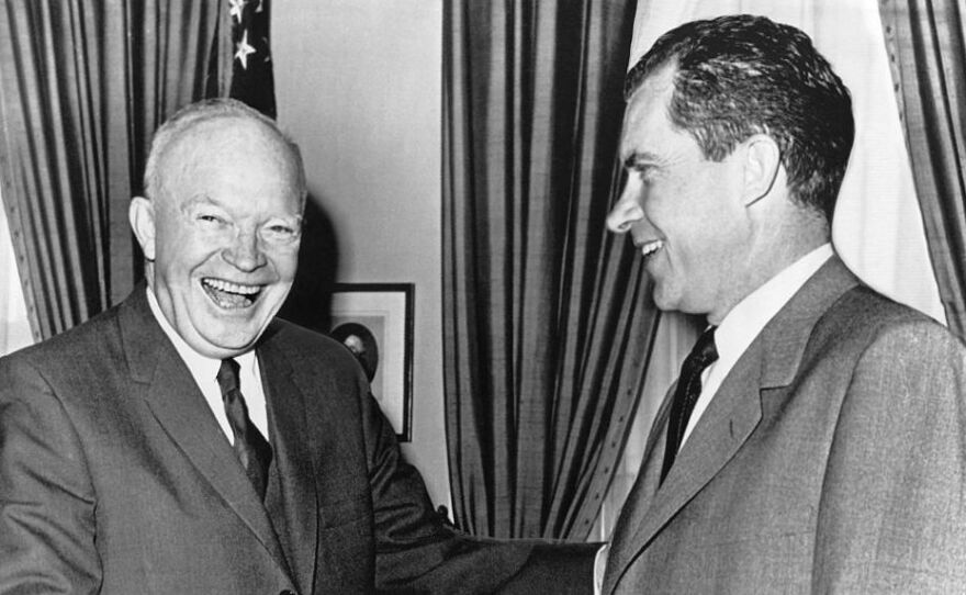President Dwight D. Eisenhower (left) shakes hands with Vice President Richard Nixon after a conference at the White House on Oct. 3, 1960.