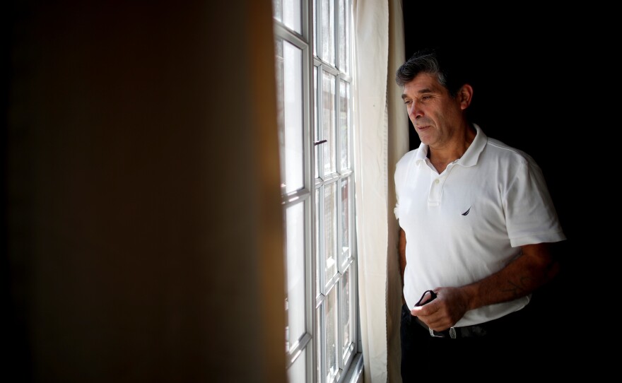 Claudio Rojas, a 55-year-old handyman who was deported from the U.S. in 2019, poses for a photo in his home in Moreno, Argentina, Saturday, May 8. His wife, two sons and two grandsons remained in Florida.