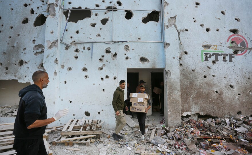 A view of destruction after an Israeli strike on a humanitarian aid distribution warehouse at Nuseirat refugee camp in Deir al-Balah, Gaza, on Thursday.