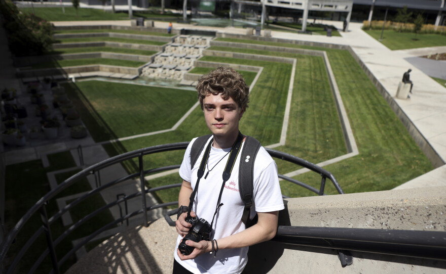 Student Kevin Haslem takes photos near the site where conservative commentator Charlie Kirk was killed on the campus of Utah Valley University in Orem, Utah, on Aug. 27, 2026.