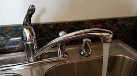 Water runs from a faucet in a College Area home, February 7, 2018.