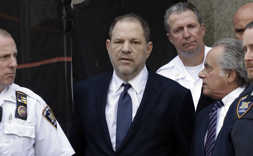 Harvey Weinstein (left) and his attorney Benjamin Brafman leave a New York court, where Weinstein pleaded not guilty Tuesday to rape and other abuse violations.