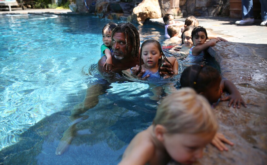 For 20 years, Conrad Cooper has been making children in LA water-safe by earning his young students' unwavering trust.