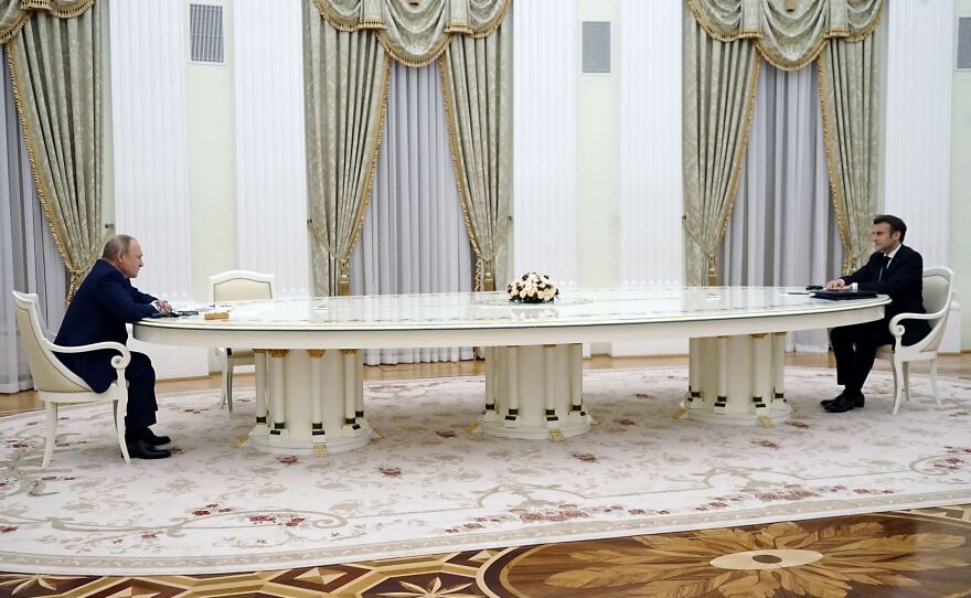 French President Emmanuel Macron (right) meets with Russian President Vladimir Putin in Moscow on Feb. 7, 2022, for talks in an effort to find common ground on Ukraine and NATO, at the start of a week of intense diplomacy over fears Russia is preparing an invasion of its pro-Western neighbor.