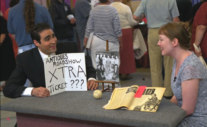 Simeon Lipman appraises a 1951 baseball signed by the Yankees and Marilyn Monroe, which was originally appraised for $15,000 in 2003. It is now valued between $25,000 and $35,000.