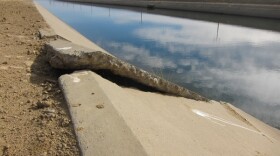 Cracks and buckle in concrete lining of Delta Mendota Canal.