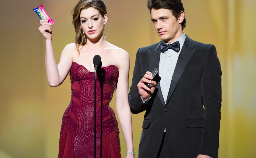 Anne Hathaway and James Franco. She had so many dress changes that the cost of her gowns probably equalled the GNP of a small country.