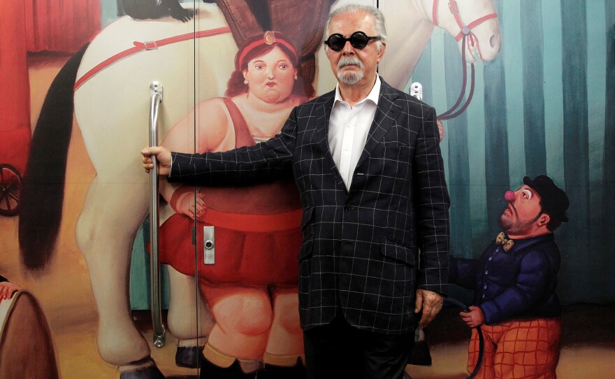 Colombian painter and sculptor Fernando Botero poses inside the "<em>Tren de La Cultura"</em> ("Train of Culture"), during a news conference for the exhibition "Fernando Botero: The Circus," in Medellín, Colombia, Jan. 30, 2015.