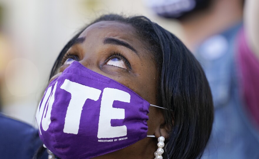 WASHINGTON: Janice Jamison, Evans, Ga, reacts after hearing the announcement by CNN that former vice president and Democratic presidential candidate Joe Biden had defeated Pres. Donald Trump, Saturday, Nov. 7, 2020, at McPherson Square in Washington.