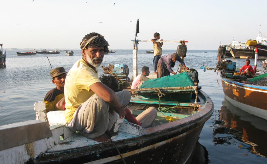 A Gwadar fisherman relaxes as the sun goes down.