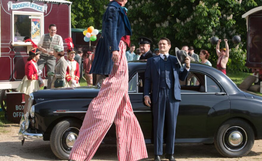 Inspector Sullivan (Tom Chambers) arrives and is taken by a tall circus act.