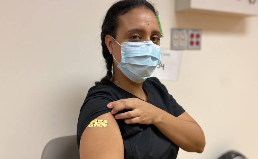 Lina Castillo, who works in PeaceHealth's urgent care clinic, says she had no hesitation about getting her first or second shot of the Pfizer vaccine. Castillo's hospital PeaceHealth St Joseph Medical Center in Bellingham, Wash., has just started giving its health care workers their final shot, which makes the vaccine about 95 percent effective against COVID-19.