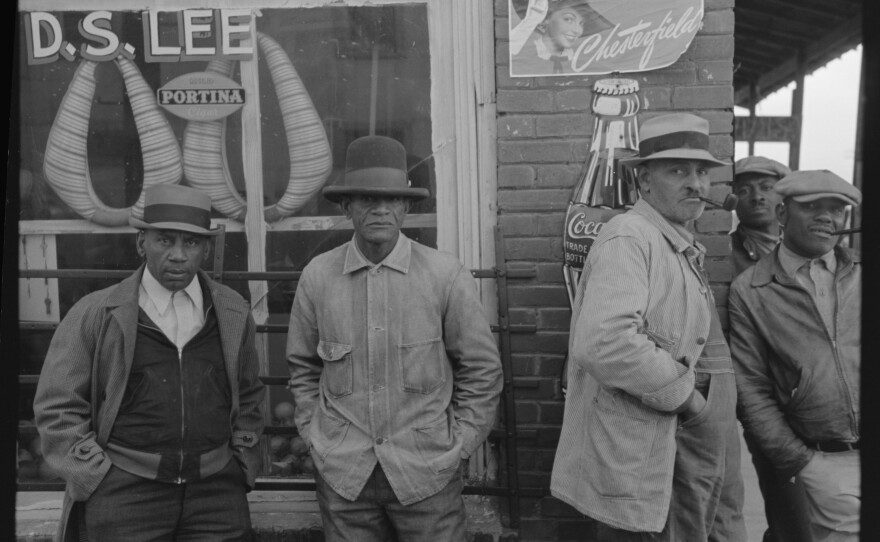 Folks in front of a general store in Mound Bayou, 1939.