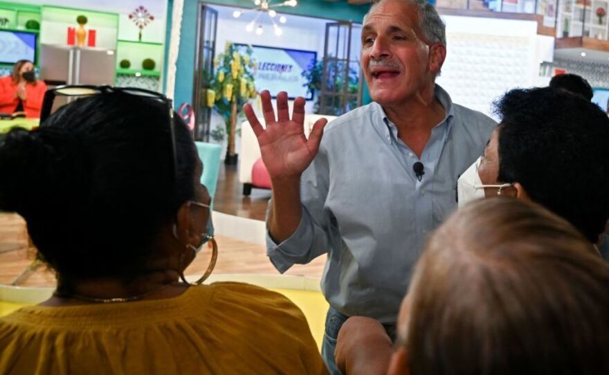 Tegucigalpa's mayor and presidential candidate for the ruling National Party Nasry Asfura gestures as he takes part in a TV show on Friday.