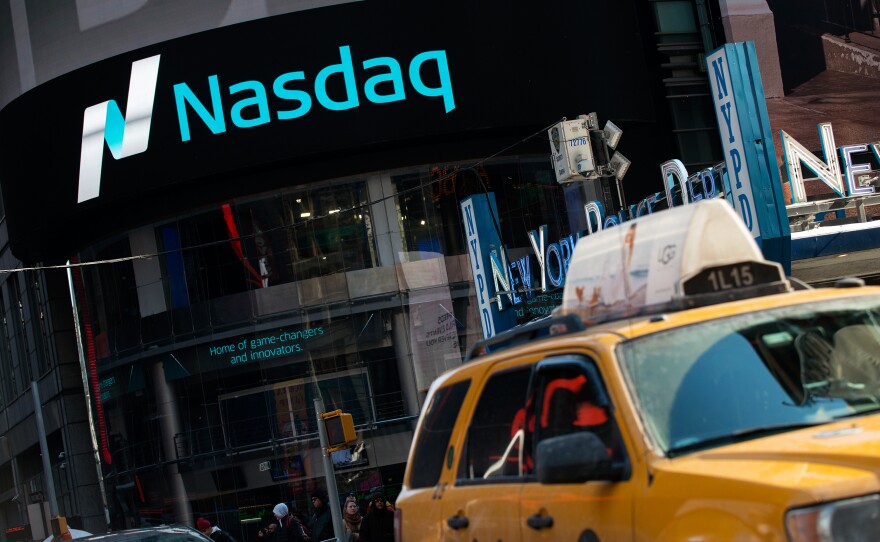 As the Nasdaq closes above the record set 15 years ago, stock analysts are debating whether the market is approaching another bubble.