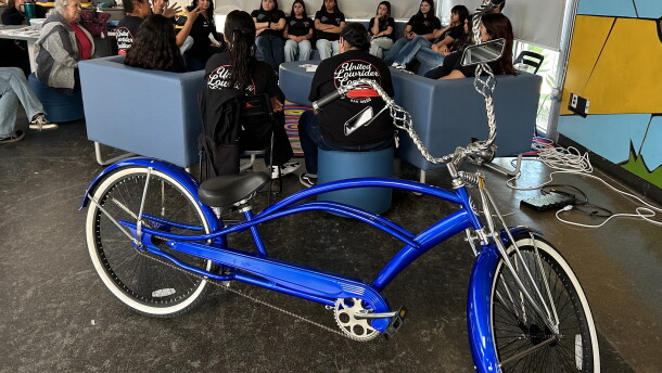 Mentors with the United Lowrider Youth Leadership Bike Club speak to students in the program on April, 28, 2026.