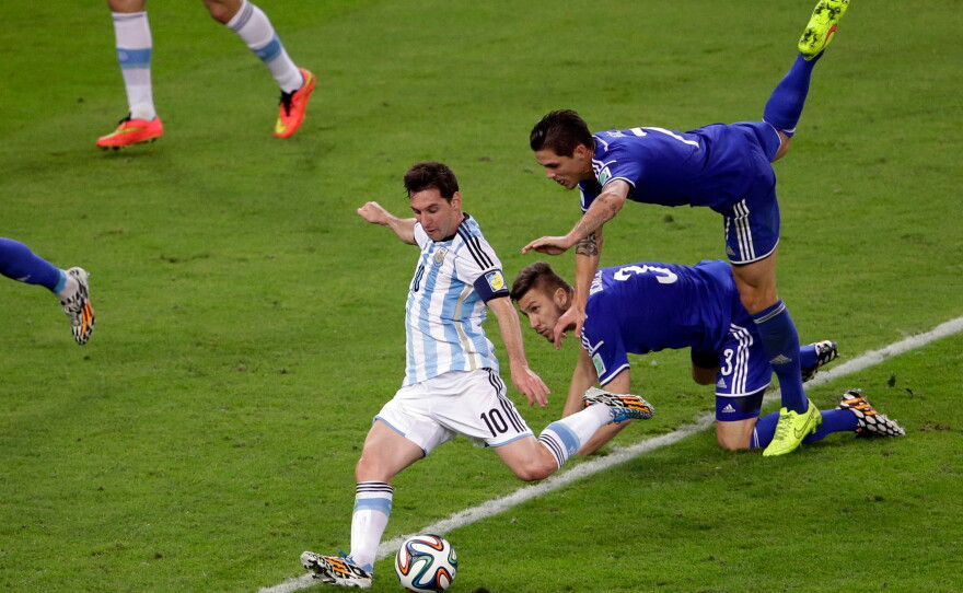 Argentina's Lionel Messi scores his team's second goal during the group F World Cup soccer match against Bosnia in Rio de Janeiro, June 15, 2014.
