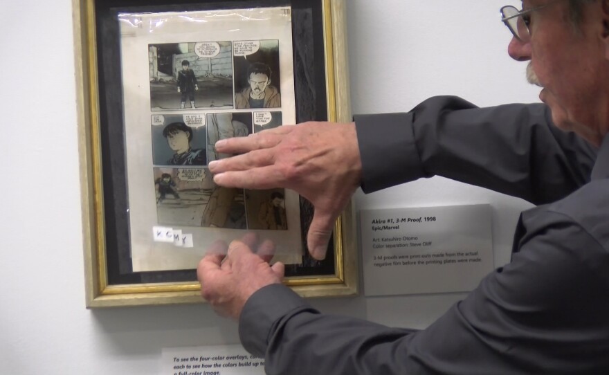 Steve Oliff demonstrates the different layers in an old 3M color key on Oct. 3, 2023.