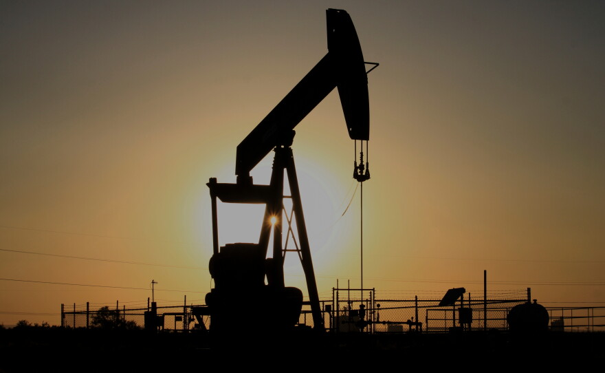 A pump jack operates at sunset in the Permian Basin near Loving, N.M., on Tuesday, May 20, 2025.