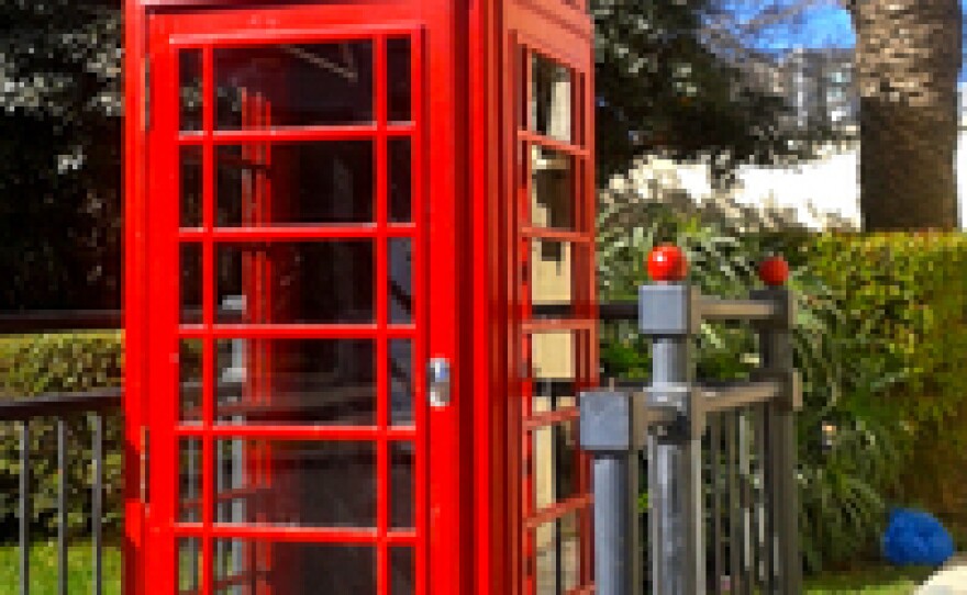 A quintessentially British phone booth greets those arriving on the British side of the border with Spain. Nearby is a palm tree — a reminder that this is not in the British Isles.